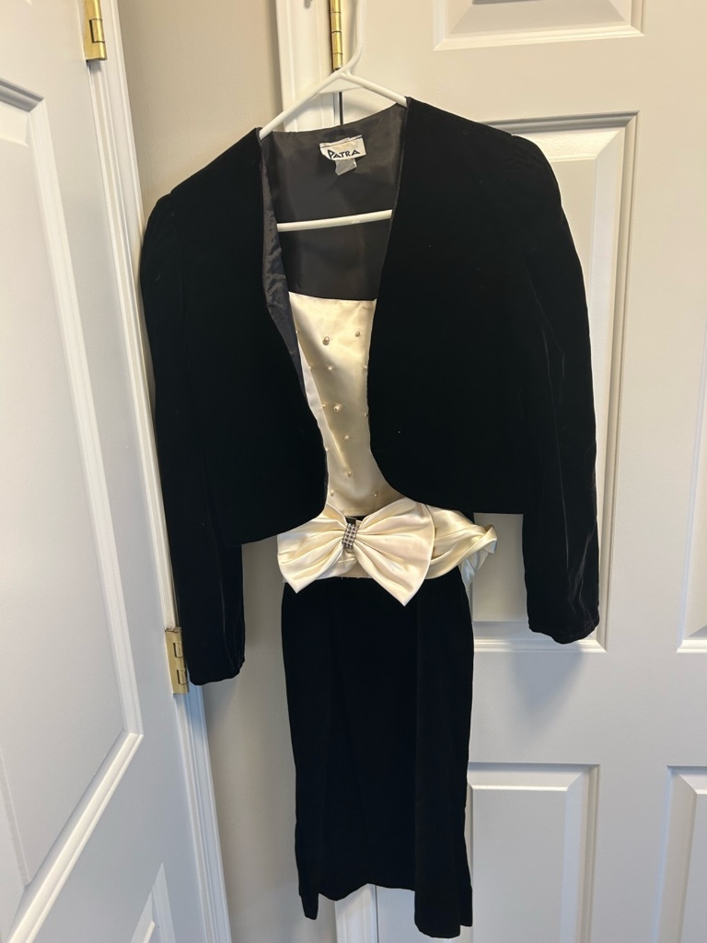 Patra Black Velvet Cropped Jacket with Ivory Satin Bow Accent